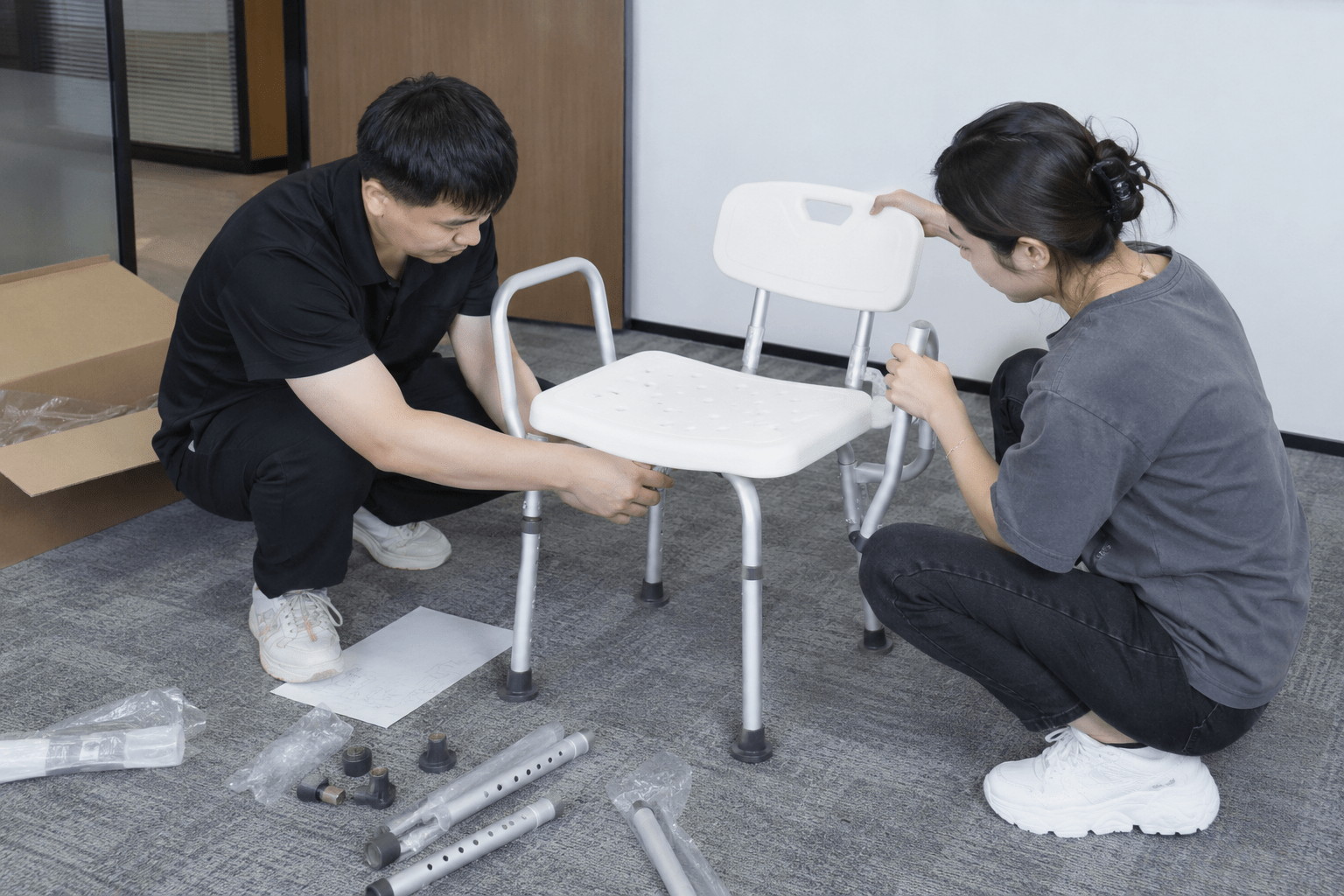 Representative staff assembling a shower-chair sample